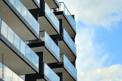 Apartment building with blue sky and clouds