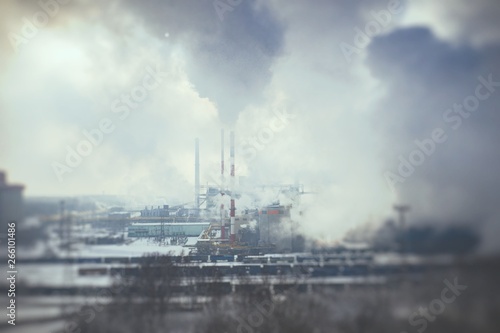 Aerial view of power plant. Fuming chimney. Heavy industry from above.