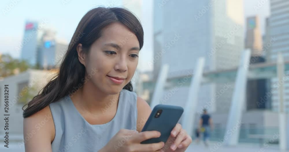 Woman use of smart phone in the city Woman use of smart phone in the city