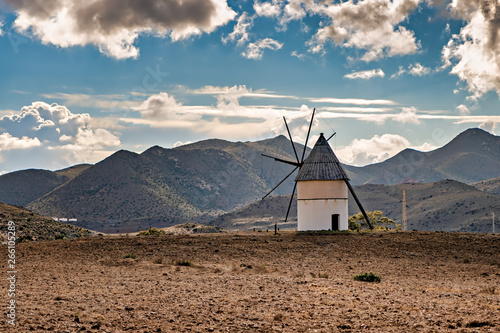 Fotografie Landscape with windmill in Cabo de Gata natural park in Almeria, Spain
