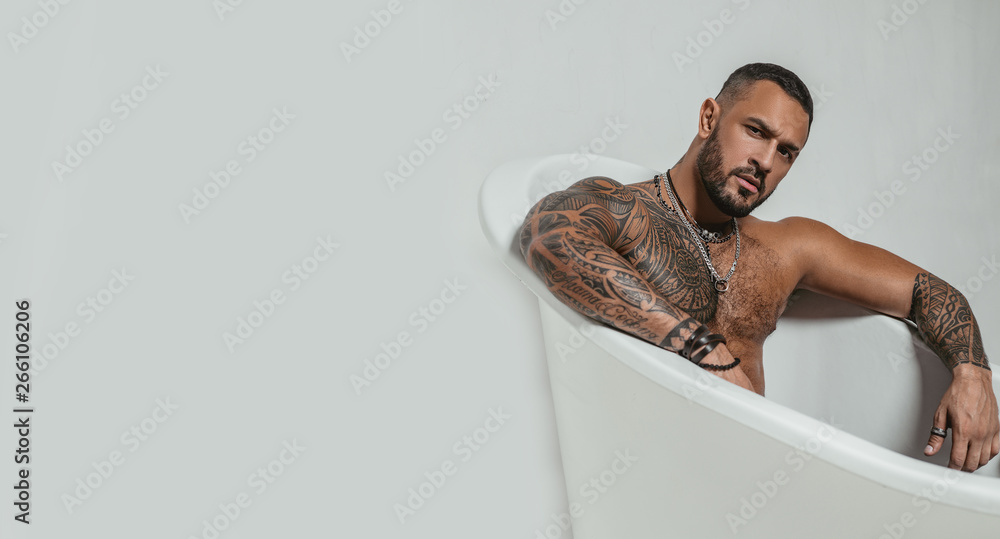 spa and hygiene. time to relax in bathroom. confidence charisma. brutal  sportsman. steroids. muscular man with