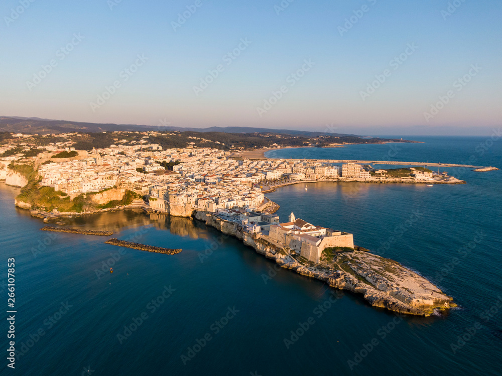 Aerial sunrise view of Vieste town and Church of San Francesco, Italy