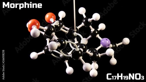 Morphine C17H19NO3 molecule isolated on black background rotating photo