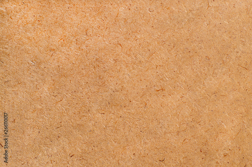 Fiberboard close-up, brown.