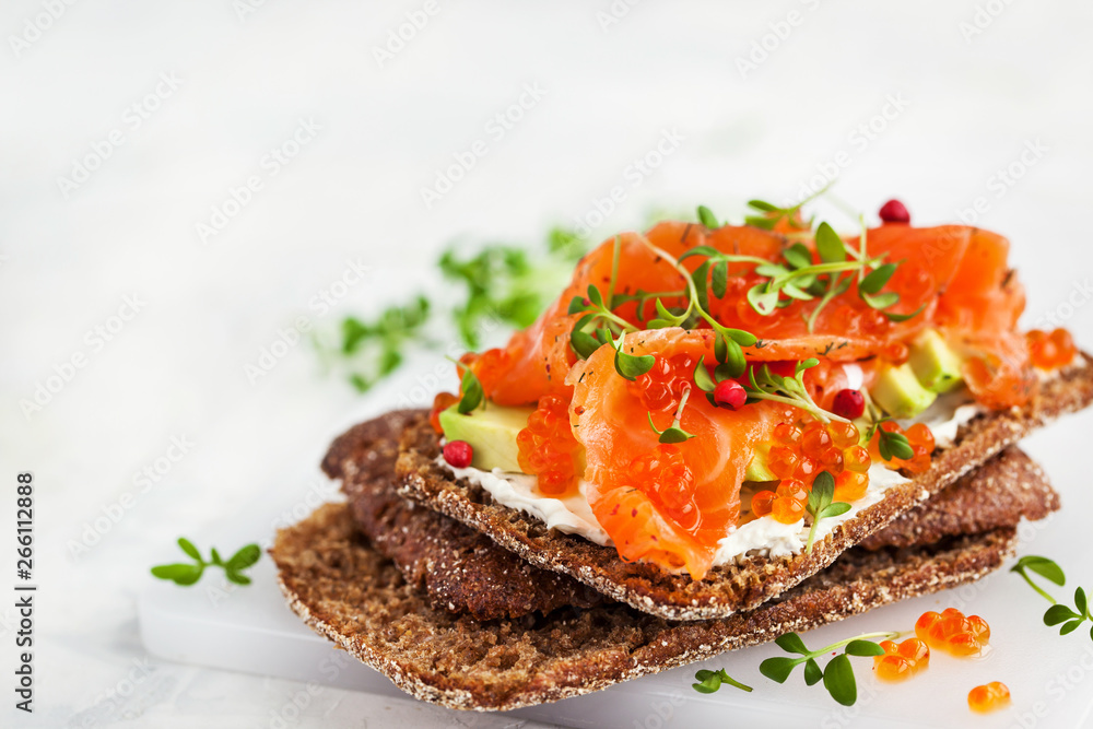 Salted salmon, red caviar, avocado and cream cheese rye crisp toast Salted salmon, red caviar, avocado and cream cheese rye crisp toast