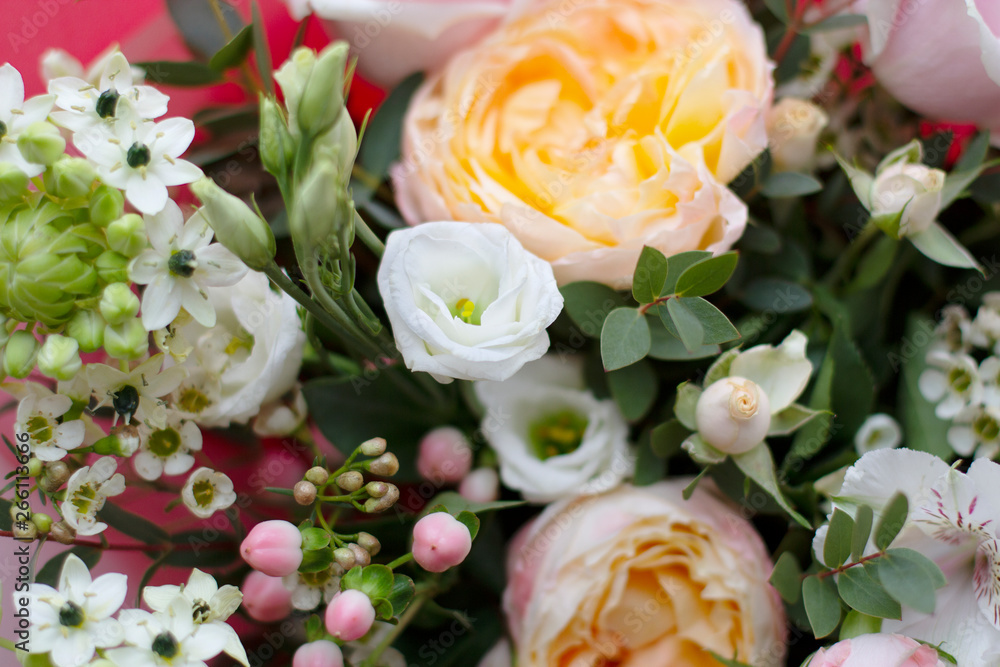 beautiful spring various flowers of delicate pink white and yellow shades in a large bouquet on top
