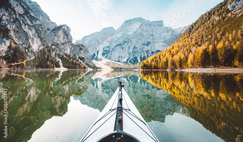 Kayak on alpine lake in fall photo