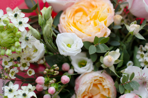 beautiful spring various flowers of delicate pink white and yellow shades in a large bouquet on top