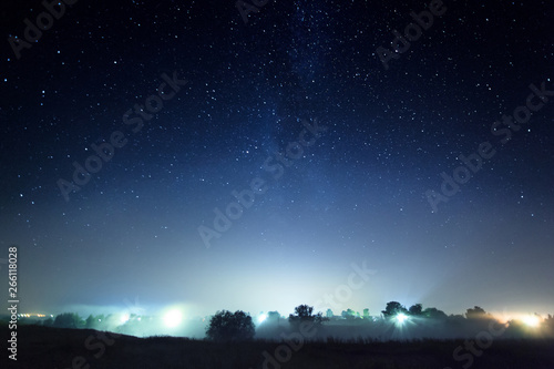 Night shining starry sky, blue space background with stars, cosmos, meteor shower at the constellation of a Perseida