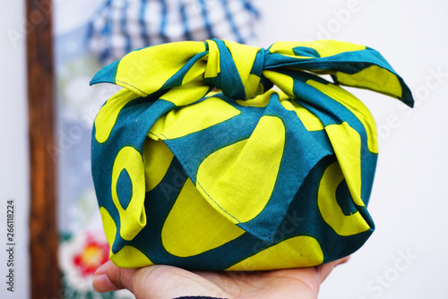 Japanese culture item, Furoshiki for wrapping gift and lunch box image yellow color and blue color photo