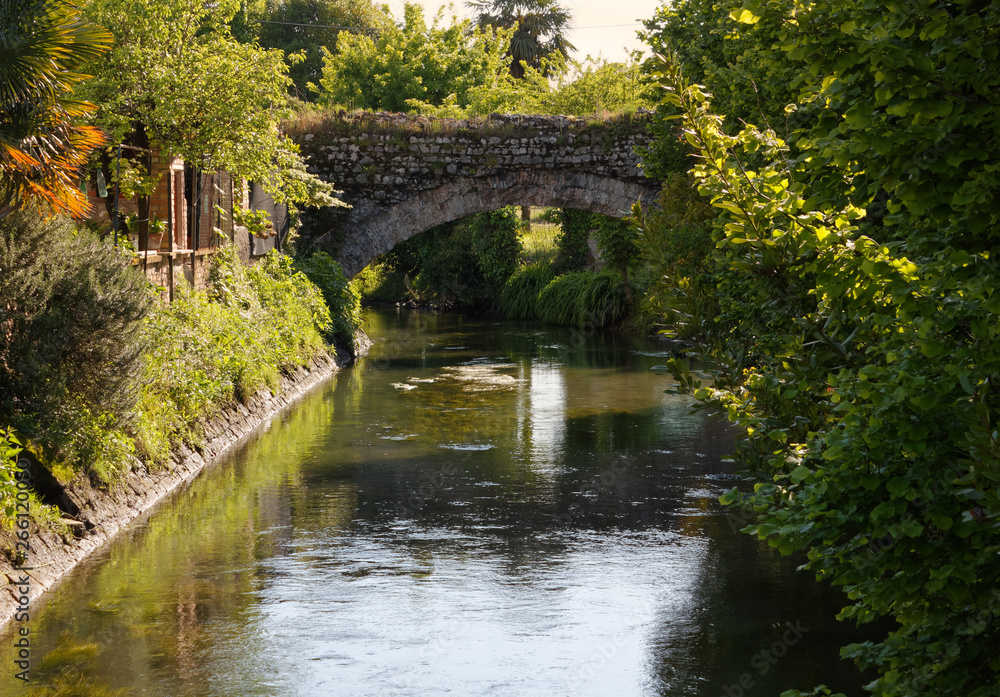 Ancient Bridge over a Canal in Aquileia, Italy Ancient Bridge over a Canal in Aquileia, Italy