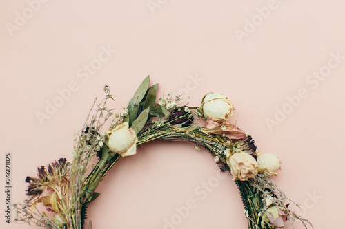 dried wreath of flowers on a pink background (wedding)
