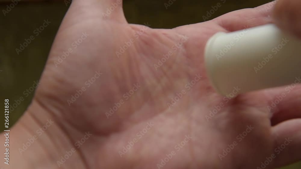 Vitamin tablets on the male palm Vitamin tablets on the male palm