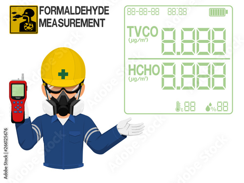 An Industrial worker with respirator is presenting display screen of the gas detector