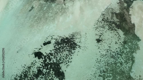 Aerial view, flight over lagoon of the Maldives island Bodufinolhu or Fun Island resort, South Male Atoll, Maldives photo