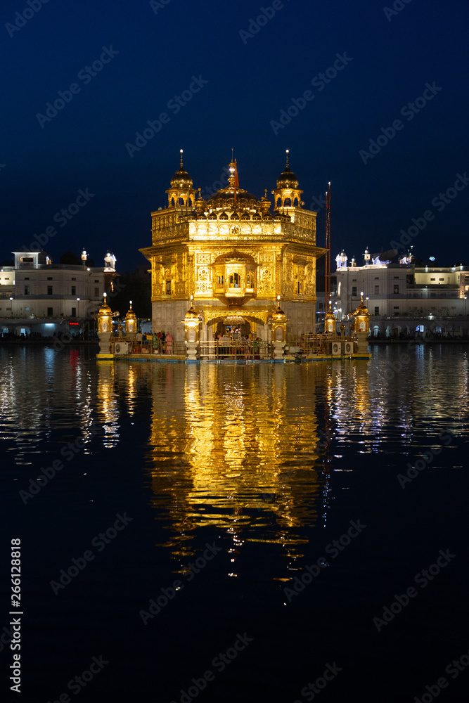 Night view to the Golden temple (Harmandir sahib) with reflection in Amritsar, Punjab, India Night view to the Golden temple (Harmandir sahib) with reflection in Amritsar, Punjab, India