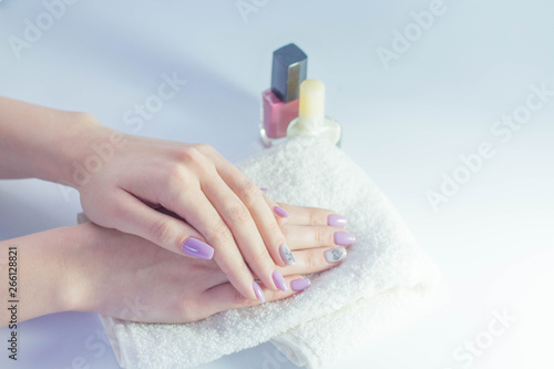 hands of a girl nail polish towel cosmetics