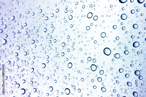 Water droplets texture on blue background