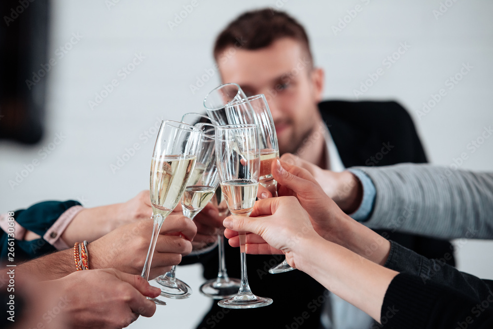 Well done work success young business people toasting each other and smiling while standing in the board room coworking, drink champagne celebrate christmas birthday new year contract Well done work success young business people toasting each other and smiling while standing in the board room coworking, drink champagne celebrate christmas birthday new year contract