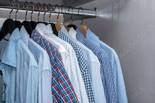 Men Shirts hanging in Closet in Living Apartment Home Interior