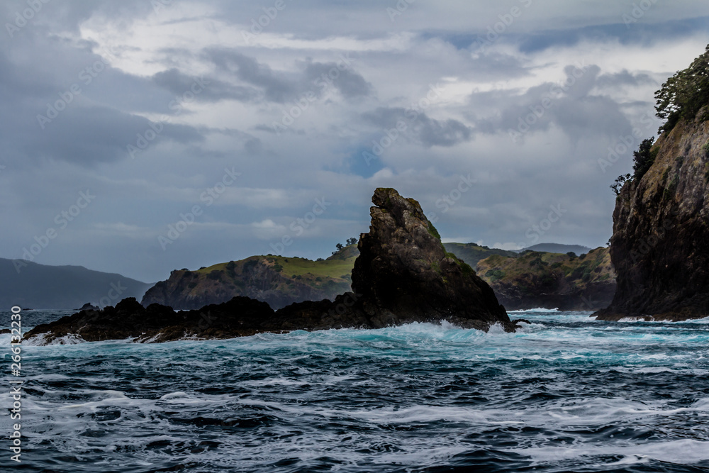 Waves crash against the rocks, Bay of Islands, New Zealand