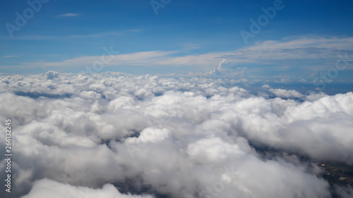 Fototapeta Naklejka Na Ścianę i Meble -  Clouds with blue sky view from airplane window.