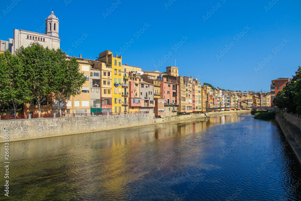 A picturesque street with colorful houses on the river bank