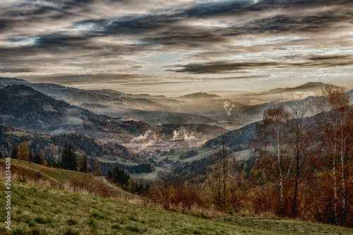 sunrise in the austrian alps shining at a sleeping valley and mystic clouds in styria HDR