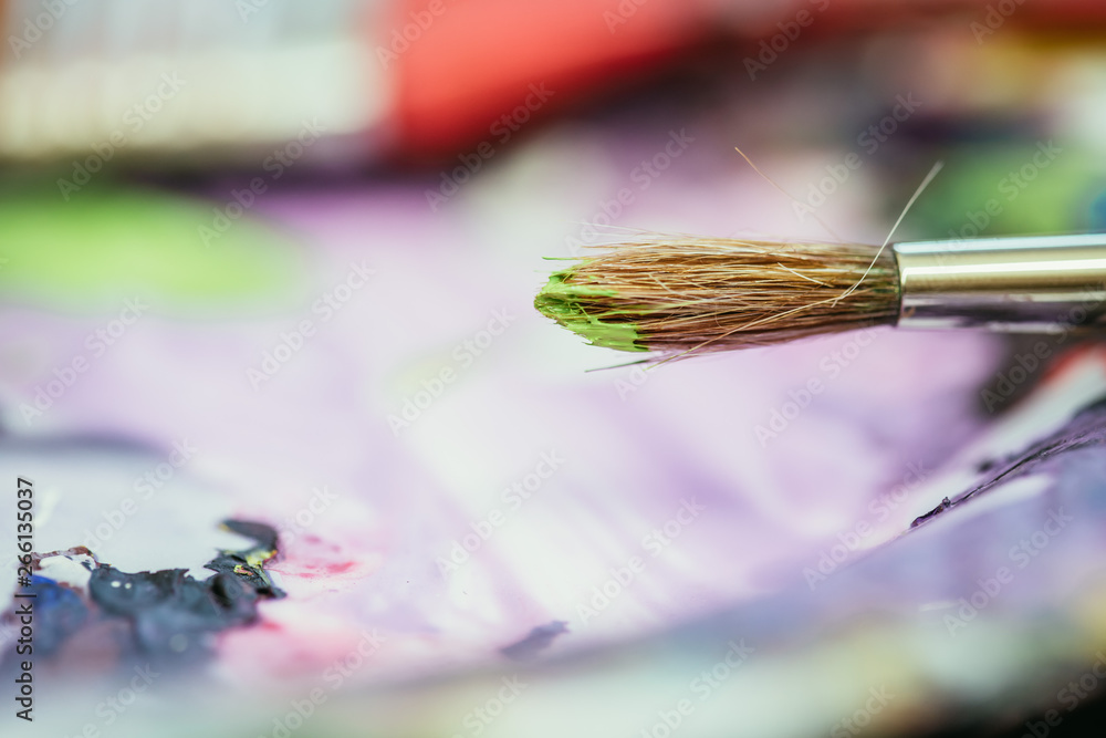 Fototapeta premium Painting artwork: paint brushes on painting background