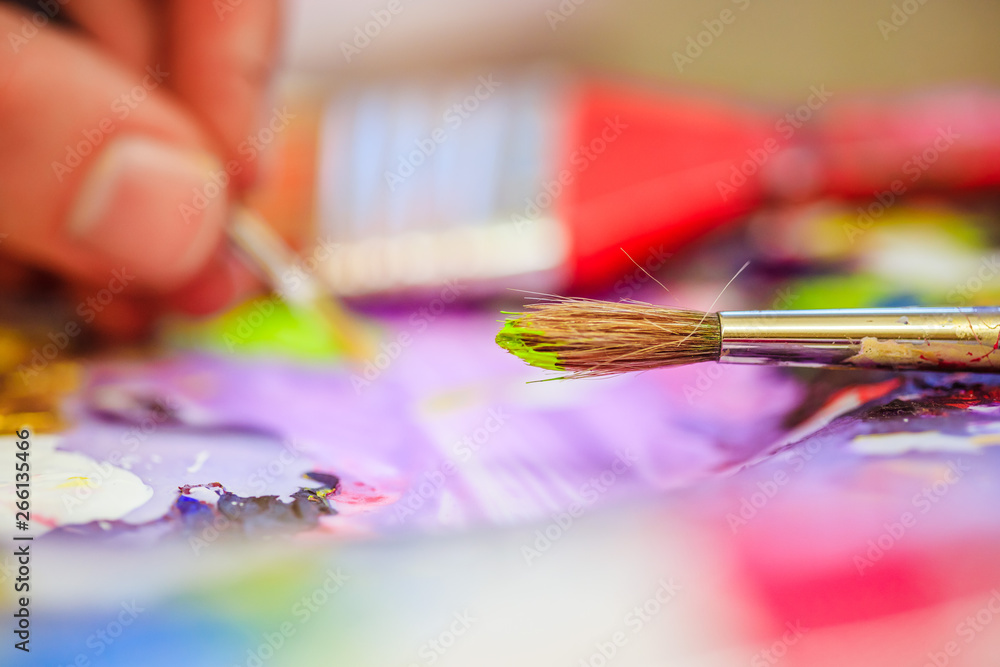Fototapeta premium Painting artwork: paint brushes on painting background