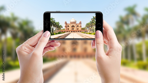 Taking a photo with mobil phone of Safdarjung Tomb, Top sights of New Delhi, India photo