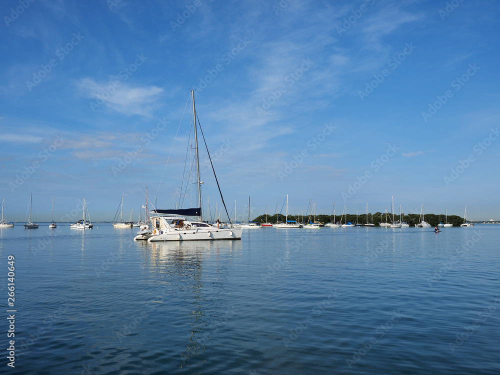 Sailboats anchored off Crandon Marina in Key Biscayne, Florida, on a calm February morning.