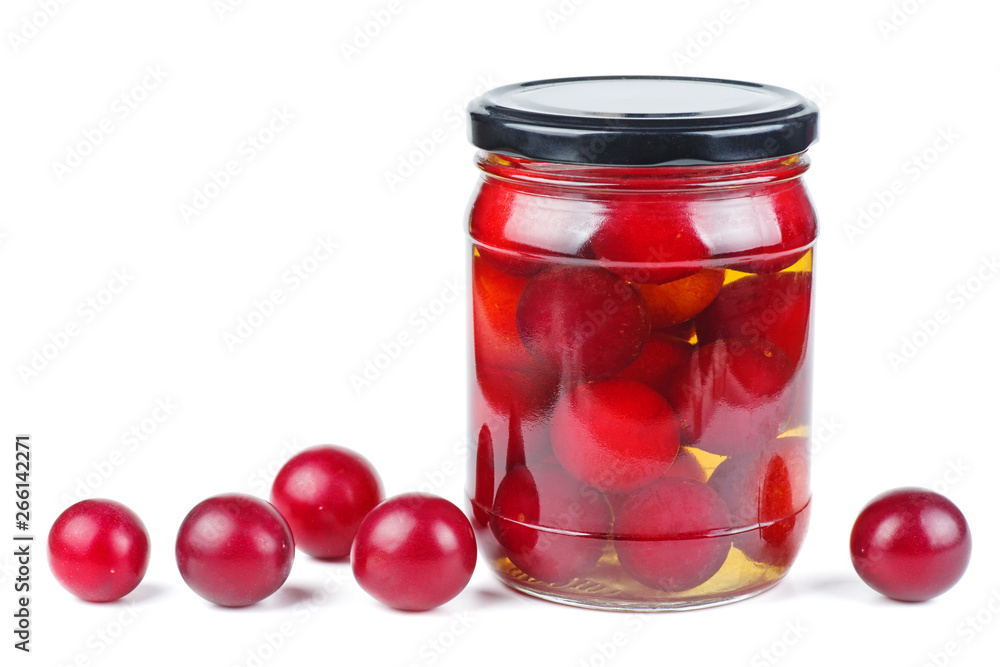 Cherry plums canned in glass jar isolated on white background Cherry plums canned in glass jar isolated on white background