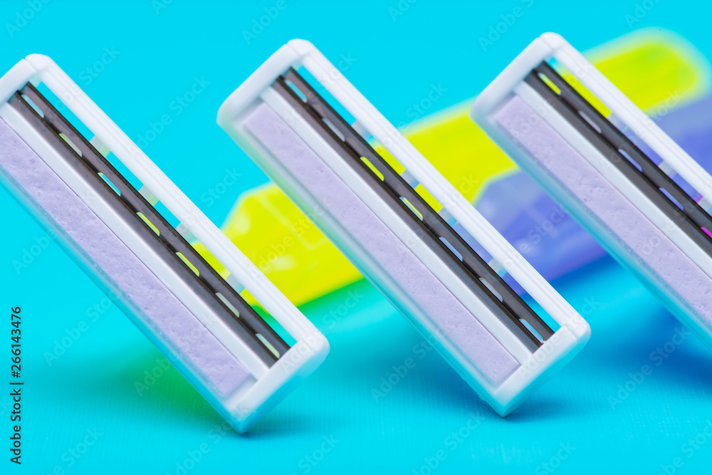 Disposable Women Razors isolated on blue background. Disposable Women Razors isolated on blue background.