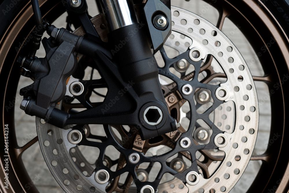 closeup tire and dish bake of sport motorcycle ( big bike ) with soft-focus and over light in the background closeup tire and dish bake of sport motorcycle ( big bike ) with soft-focus and over light in the background