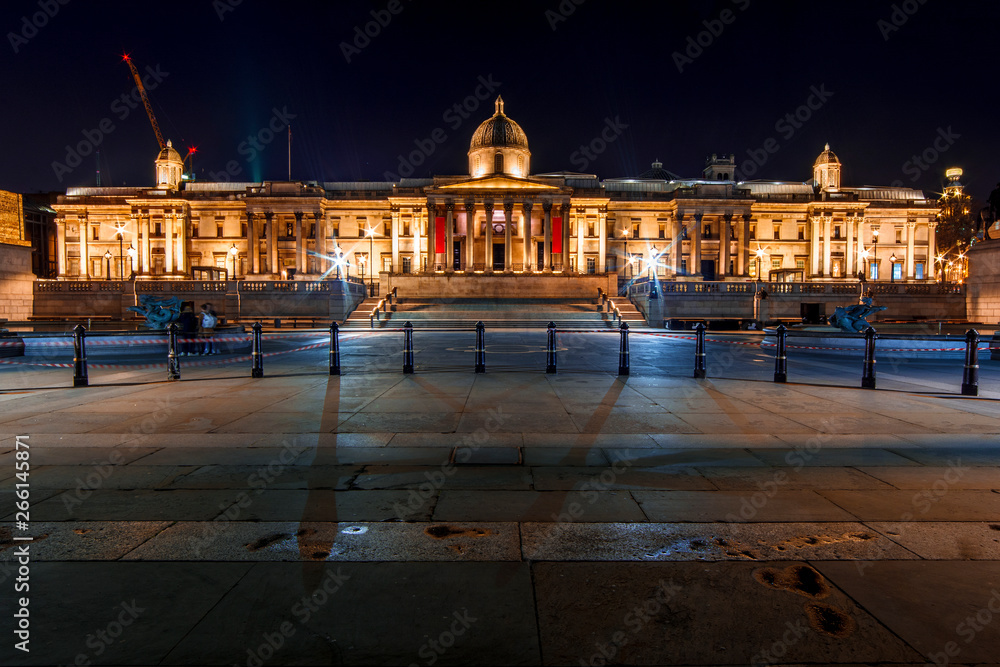 Facade of the National Gallery and the Trafalgar Square in London (England) by Night
