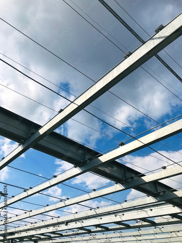 long steel beams against the background of the blue sky long steel beams against the background of the blue sky
