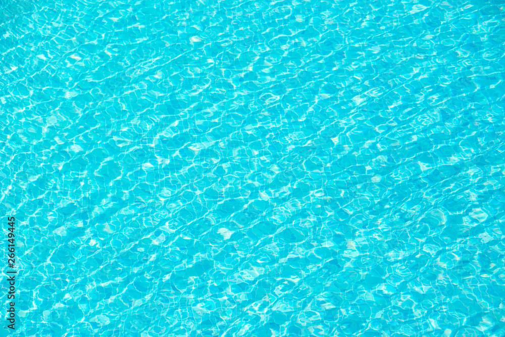 Turquoise blue ripped swimming pool water background, summer concept