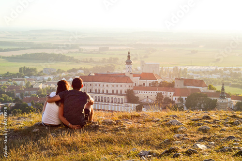Photography Young tourist couple overlooking romantic Mikulov Castle, South Moravia Region, Czech Republic