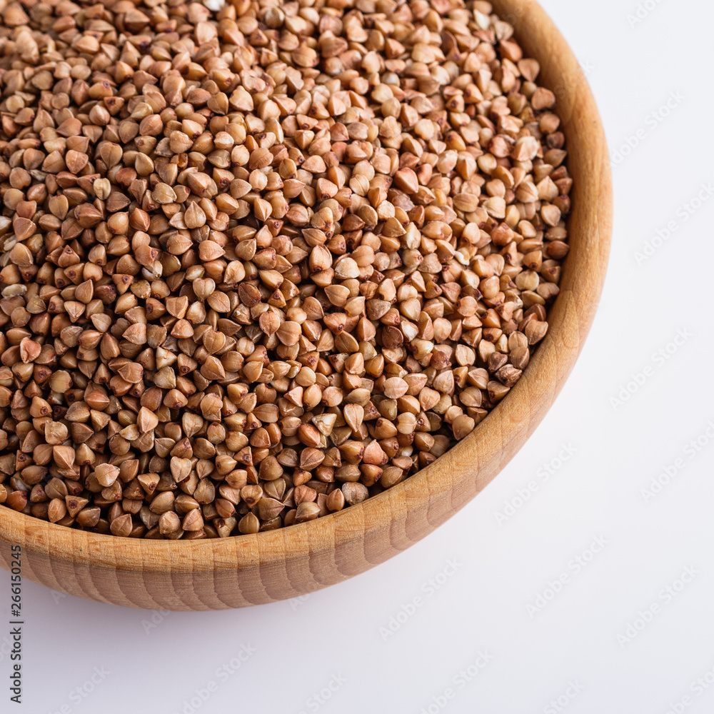 Grain buckwheat on a white acrylic background Grain buckwheat on a white acrylic background