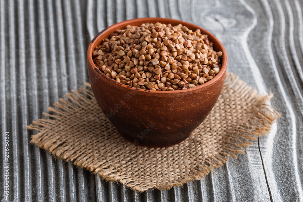 Grain buckwheat on a gray wooden background Grain buckwheat on a gray wooden background