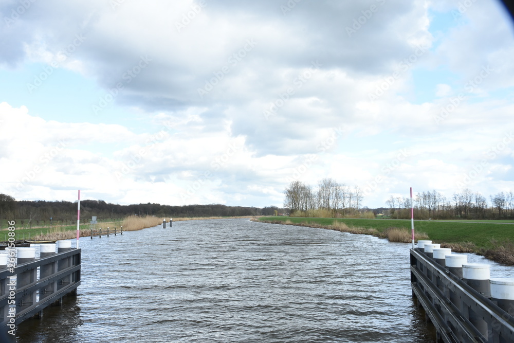 Fototapeta premium Clouds over river Oude IJssel
