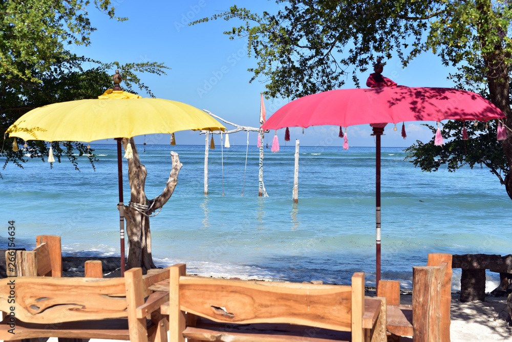 Chairs and umbrellas on a white sand beach, Gili Trawangan, Indonesia