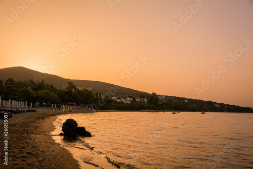 Paralia Gerakinis, Sithonia, Chalkidiki, Greece - June 29, 2014: Dawn on the beach in the village Paralia Gerakinis on the peninsula Sithonia photo
