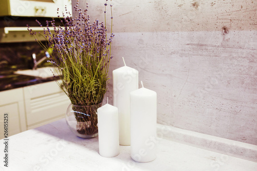 kitchen interior with white candle and lavender.