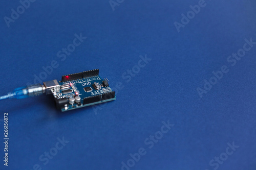 Arduino Uno boards for programming education development platform connected to PC with a USB cable. Micro controller. Technology. Electronic computing machine. Concept