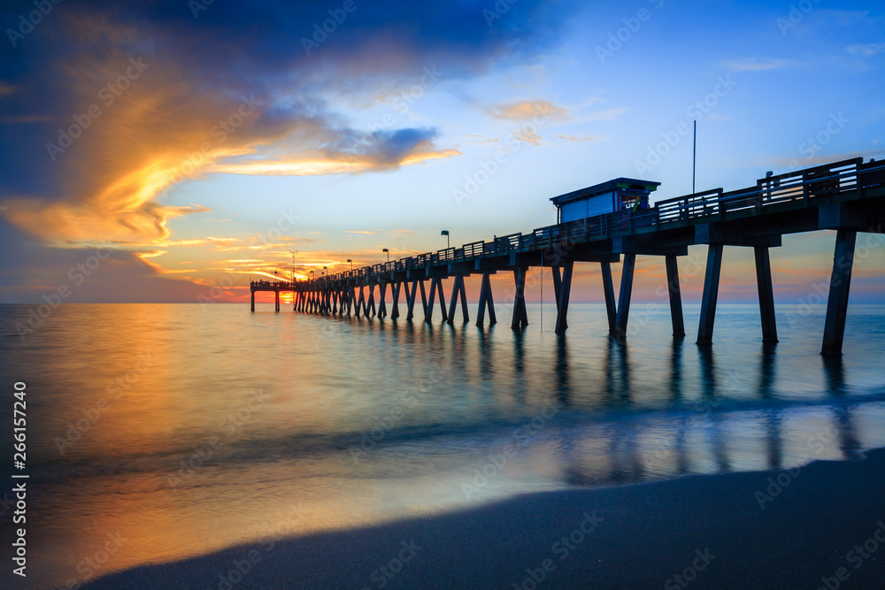 Blurred water softens as the sun sets over Venice Pier in Florida Blurred water softens as the sun sets over Venice Pier in Florida