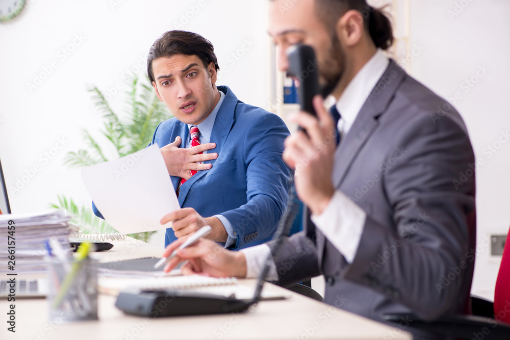 Two male colleagues in the office 