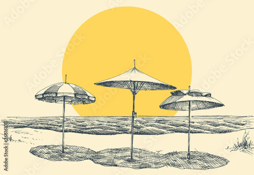 Beach and sea panorama. Umbrellas on the beach by the sea