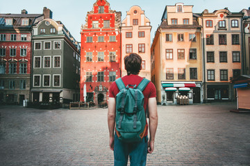 Man tourist walking in Stockholm travel sightseeing Gamla Stan Stortorget architecture lifestyle summer trip vacations in Sweden
